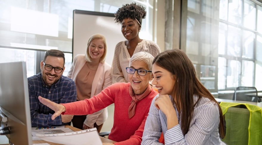 People around computer using AI in learning